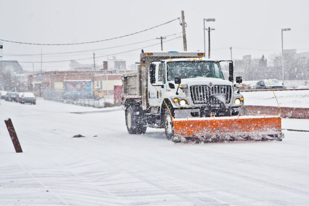 2021 02 18 k paynter snow storm-22 A city trash truck outfitted with a plow rolls down Cumberland Street