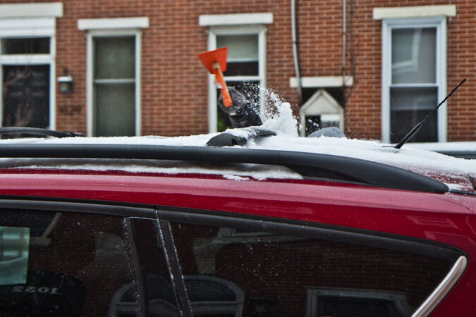 Cars parked on Philly street in the snow