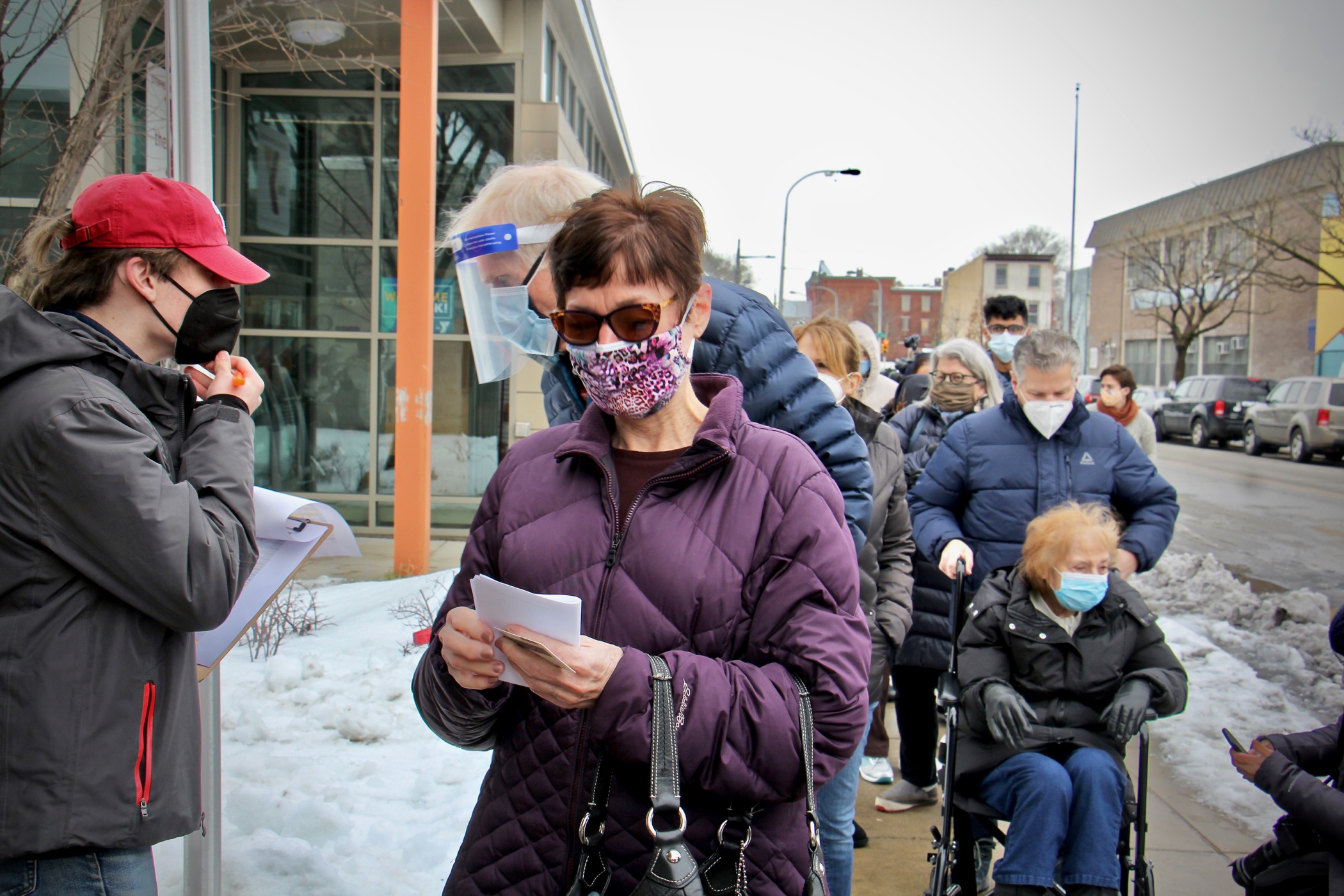 Judy Salisbury waits in line to receive a COVID-19 vaccine