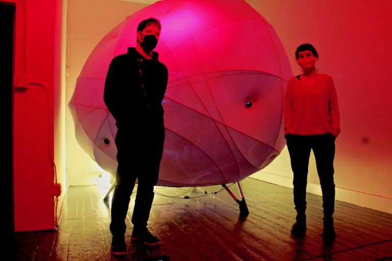 Severino Alfonso (left) and Loukia Tsafoulio are the creators of Synesthesia, a work of art exploring the interface between humans and machines, on exhibit at HOT*BED gallery in Old City. (Emma Lee/WHYY)
