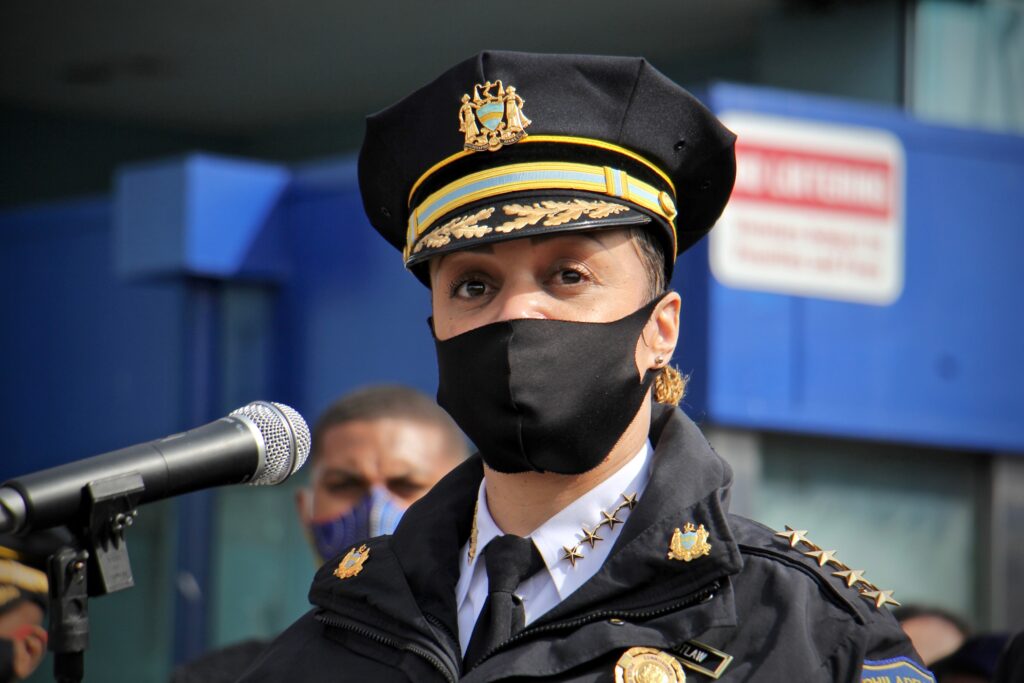 2021 02 26-e lee-danielle outlaw-philadelphia-olney transportation center mass shooting presser 2 Philadelphia Police Commissioner Danielle Outlaw speaks into a microphone, wearing a mask and standing behind a podium.