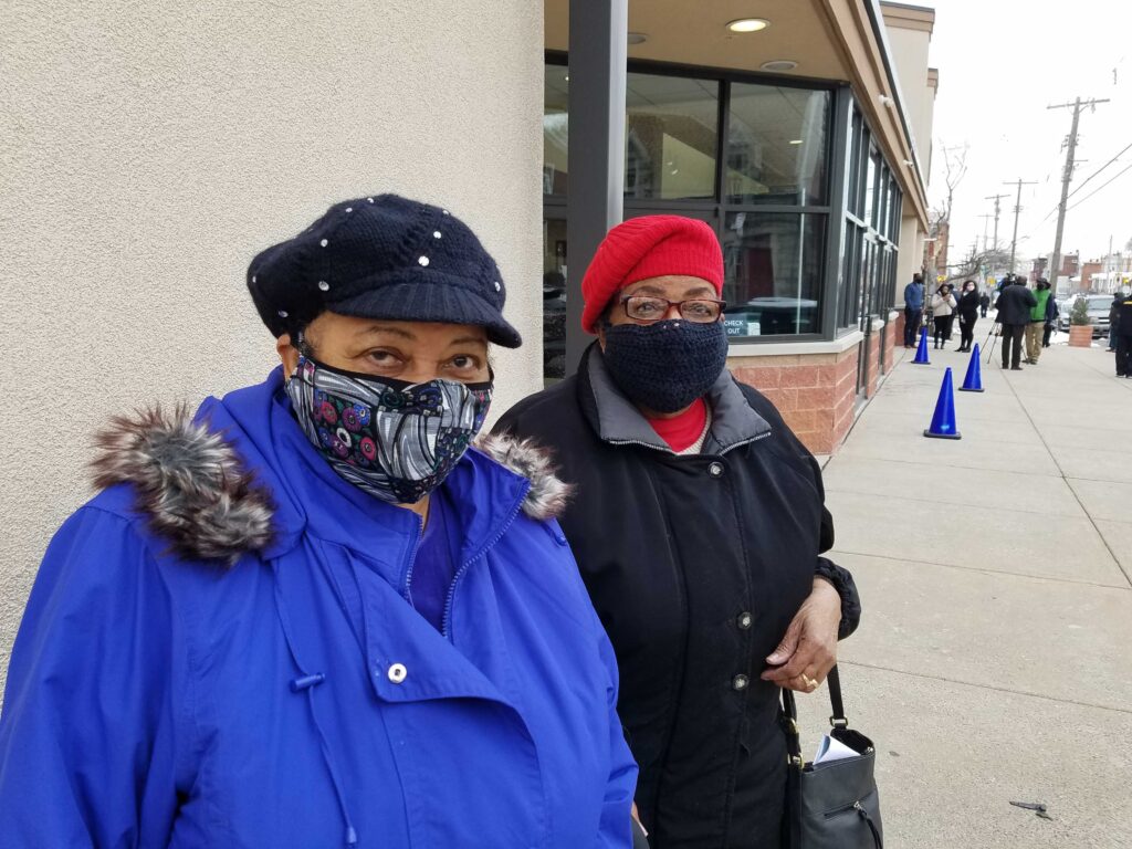 20210213_100108 Ruby K. Lane and Katherine Kirby, outside a church in West Philadelphia right after they received the first dose of the COVID-19 vaccine on Feb. 13, 2021. (Peter Crimmins/WHYY)