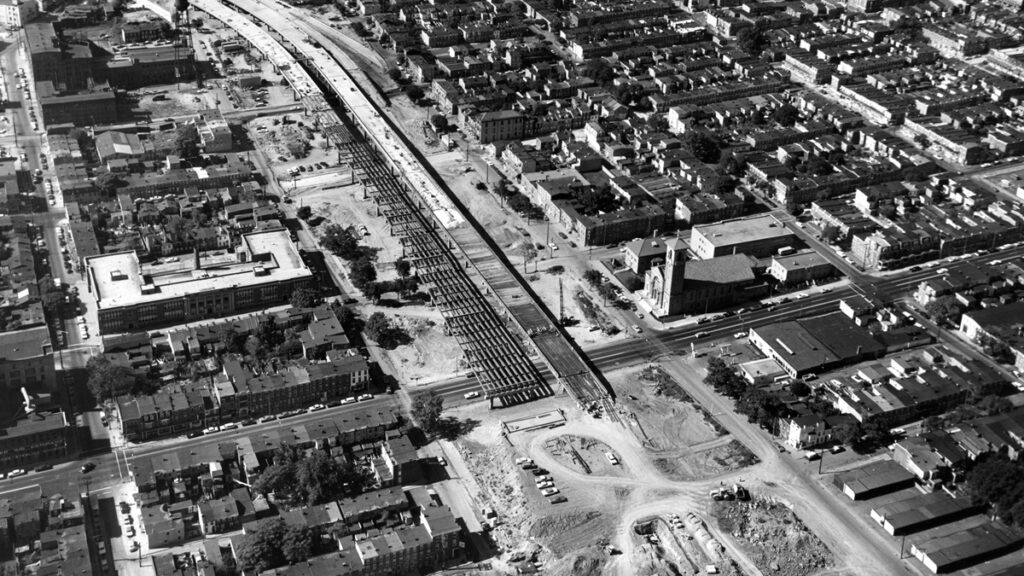 3 (1) Construction work approaches 4th Street in September 1965. On the lower right, St. Paul's Catholic Church narrowly avoided the path of the interstate. (Courtesy of Delaware Public Archives)