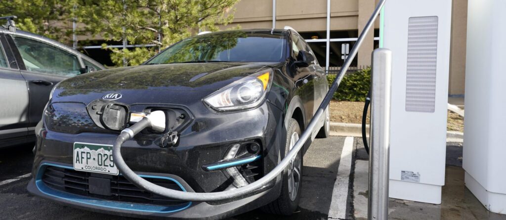AP20357113163465-scaled-e1612388706174-1920×835
A Kia Niro EV is charged at a charging station at Colorado Mills Outlet Mall Monday, Dec. 21, 2020, in Lakewood, Colo. (David Zalubowski/AP Photo)