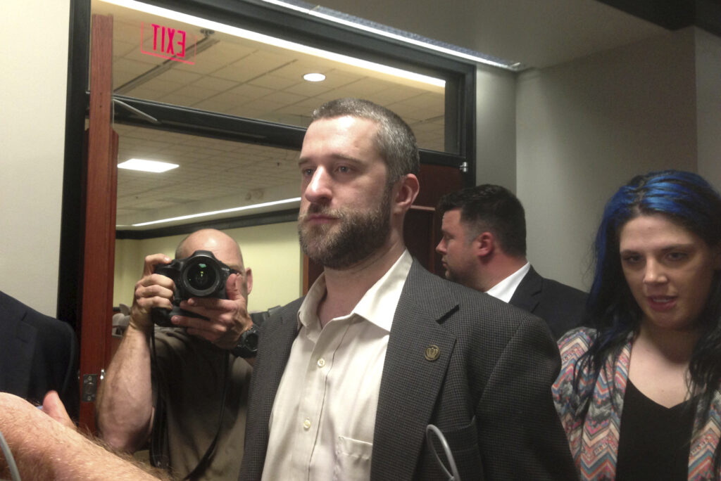 Dustin Diamond FILE - In this May 29, 2015, file photo, television actor Dustin Diamond, center, leaves court in Port Washington, Wis. (AP Photo/Dana Ferguson, File)