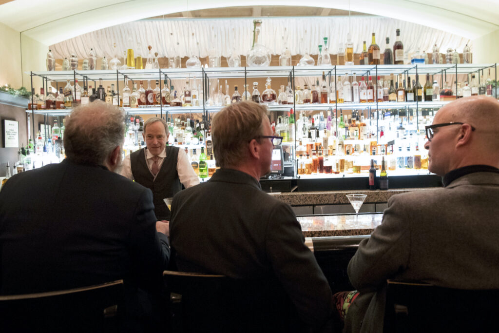 Virus Outbreak-Small Business-Employment In this Tuesday, Nov. 27, 2018, photo, a bartender talks to a customer at the Gotham Bar and Grill in New York. (AP Photo/Mary Altaffer)