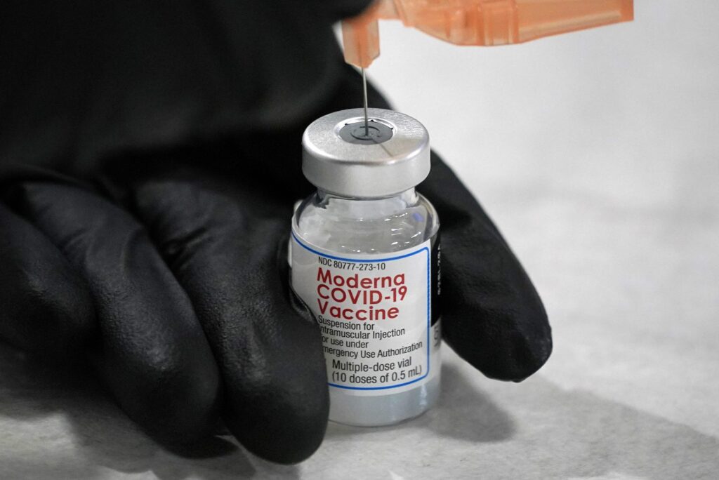 AP21028826218931-1920×1282 A syringe is loaded with a dose of the Moderna COVID-19 vaccine