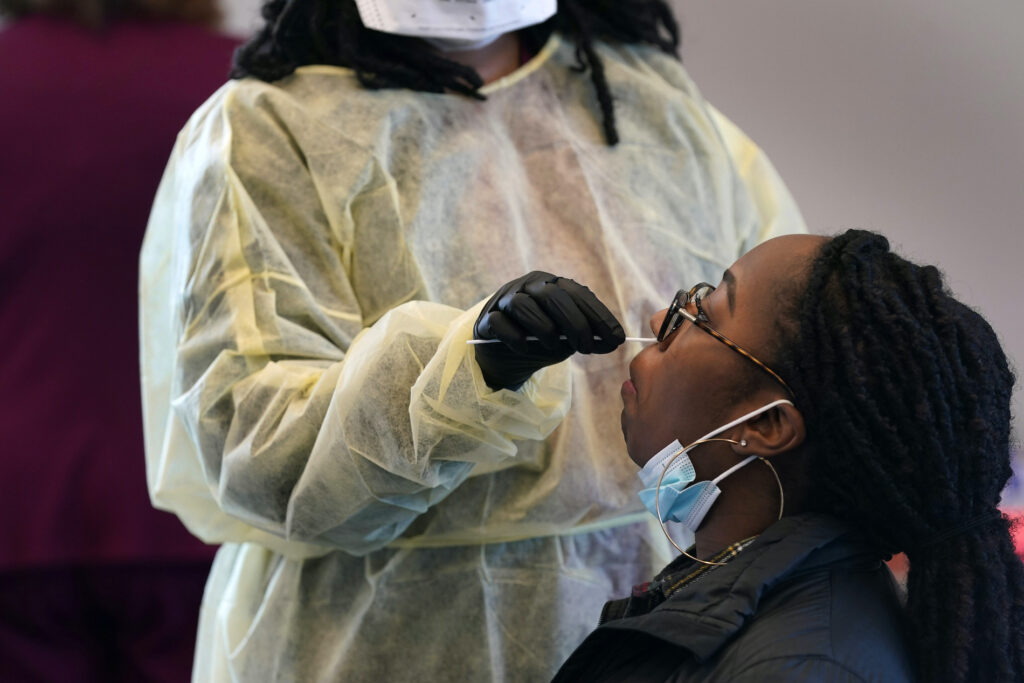 Jazmyn Finney is administered a coronavirus 15-minute rapid test at the student health center on campus at North Carolina Agricultural and Technical State University in Greensboro, N.C., Wednesday, Feb. 3, 2021. (AP Photo/Gerry Broome)