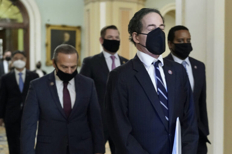 House impeachment managers led by Rep. Jamie Raskin, D-Md., walk out of the Senate Chamber in the Capitol at the end of the fifth day of the second impeachment trial of former President Donald Trump, Saturday, Feb. 13, 2021, in Washington. The Senate has acquitted Donald Trump of inciting the Jan. 6 attack on the U.S. Capitol, bringing his trial to a close and giving the former president a historic second victory in the court of impeachment. (AP Photo/J. Scott Applewhite)
