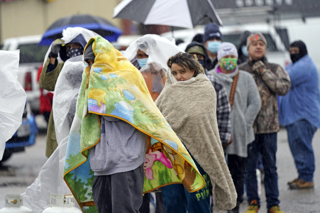 Winter Weather Texas People wait in line to fill propane tanks Wednesday, Feb. 17, 2021, in Houston. Customers waited over an hour in the freezing rain to fill their tanks. (AP Photo/David J. Phillip)