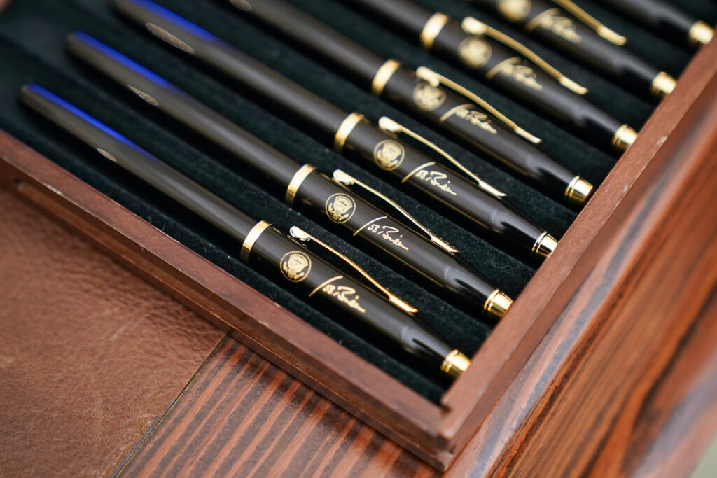 Joe Biden, Kamala Harris Pens featuring President Joe Biden’s signature and presidential seal, are displayed in the State Dinning Room of the White House, Thursday, Jan. 21, 2021, in Washington. (AP Photo/Alex Brandon)