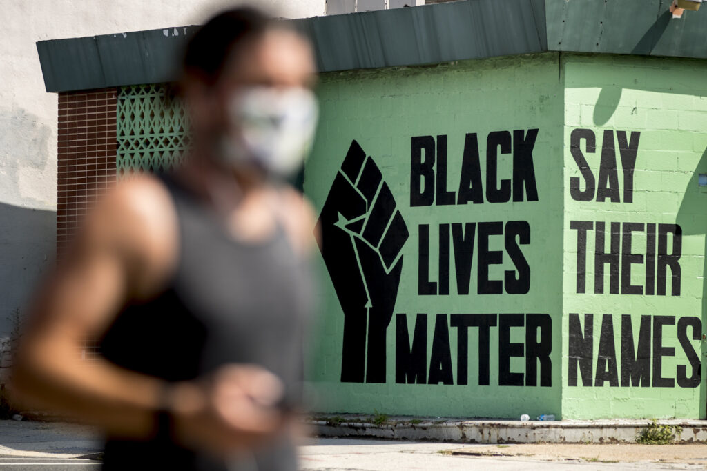 Racial Injustice Survival Fund A black lives matter mural is visible in the Shaw neighborhood in Washington, Monday, July 13, 2020. (AP Photo/Andrew Harnik)