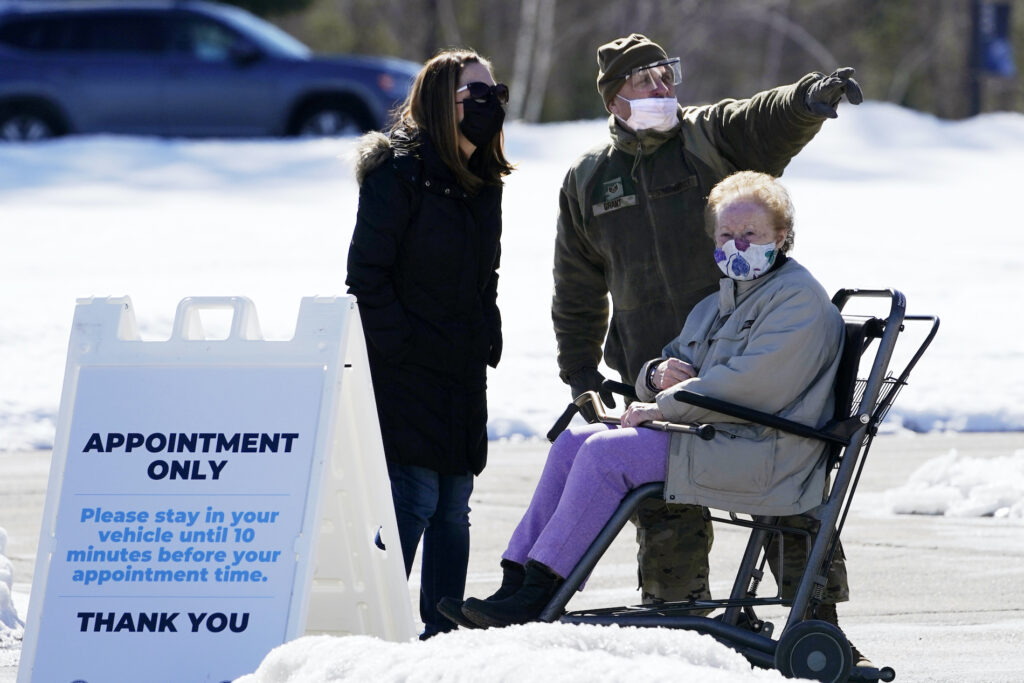 Richard Grant Sgt. Richard Grant of the Air National Guard helps point a patient in the right direction at a COVID-19 vaccination site at the Augusta Civic Center, Friday, Feb. 26, 2021, in Augusta, Maine. (AP Photo/Robert F. Bukaty)