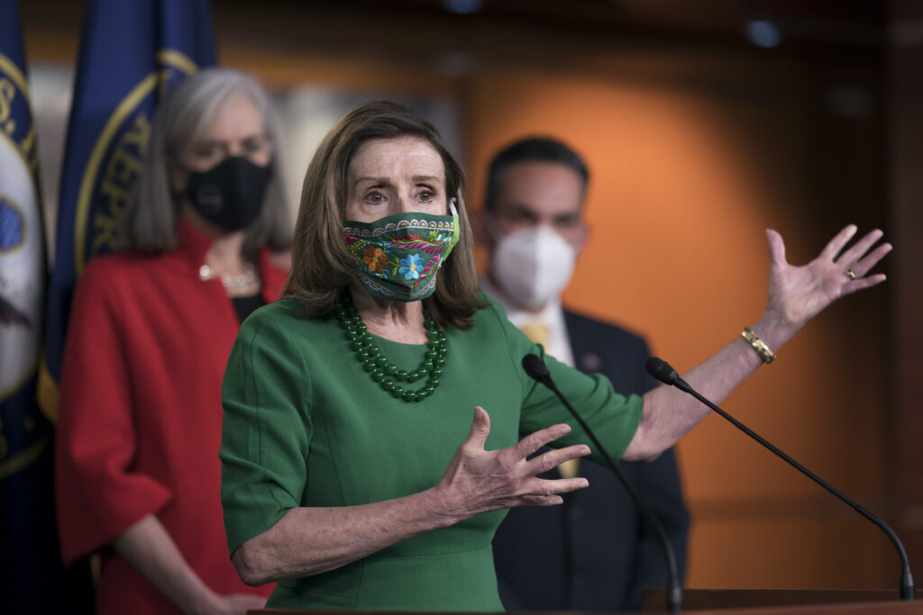 Nancy Pelosi, Katherine Clark, Pete Aguilar Speaker of the House Nancy Pelosi, D-Calif., meets with reporters before the House votes to pass a $1.9 trillion pandemic relief package, during a news conference at the Capitol in Washington, Friday, Feb. 26, 2021. (AP Photo/J. Scott Applewhite)
