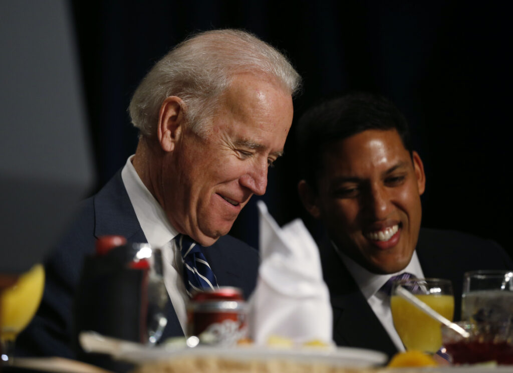 Joe Biden, Raj Shah Then-Vice President Joe Biden and USAID administrator Raj Shah are seated together at the National Prayer Breakfast in Washington, Thursday, Feb. 6, 2014. (AP Photo/Charles Dharapak)