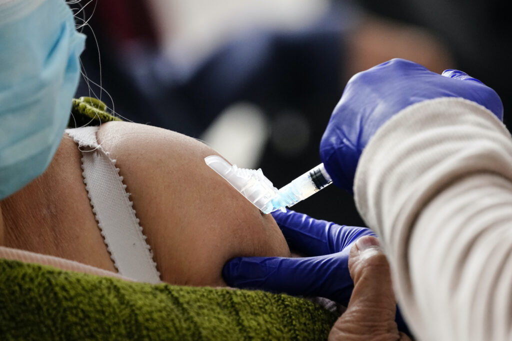 Virus Outbreak Pennsylvania A person receives a COVID-19 vaccinations at a 24-hour, walk-up clinic hosted by the Black Doctors COVID-19 Consortium