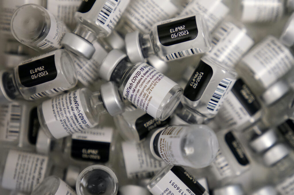 Virus Outbreak Tweaking Vaccines Empty vials of the Pfizer-BioNTech COVID-19 vaccine