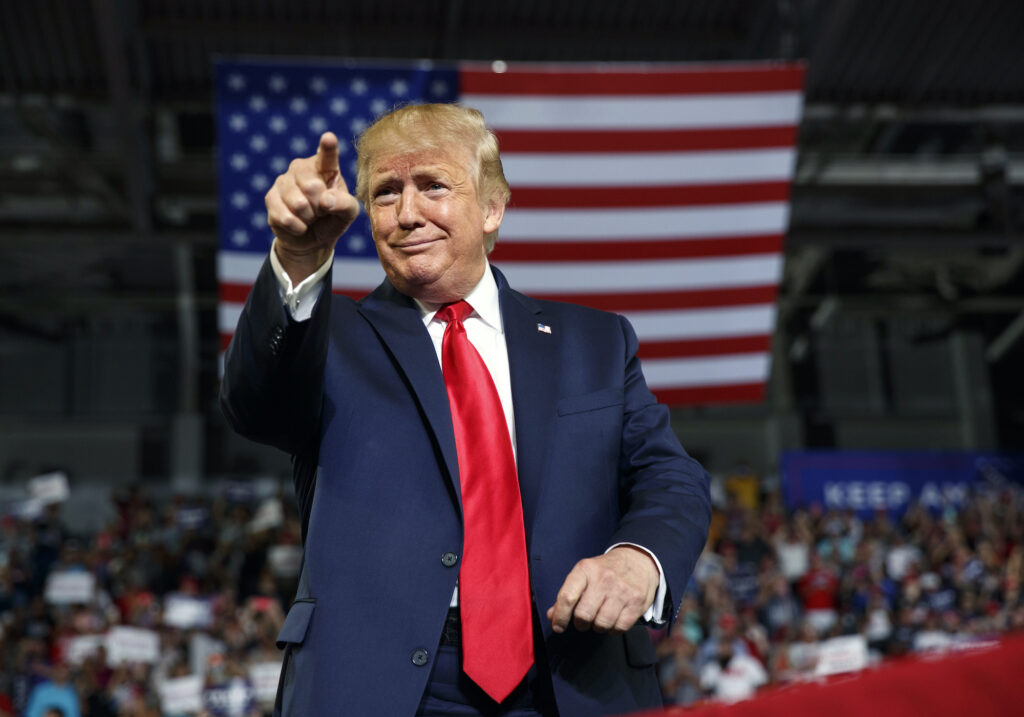 Donald Trump President Donald Trump gestures to the crowd as he arrives to speak at a campaign rally