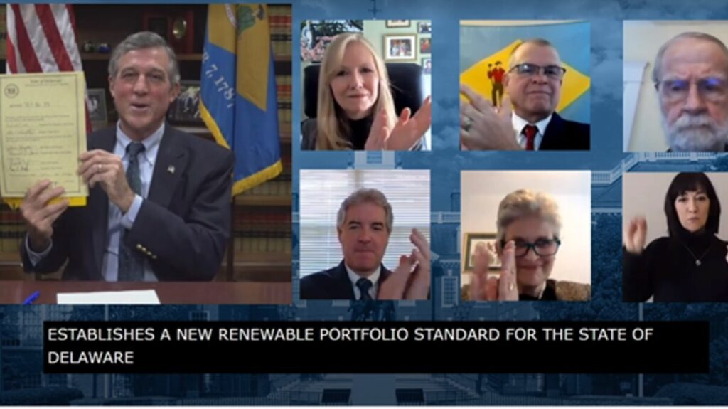 Carney bill Delaware Gov. John Carney holds a signed copy of legislation mandating an increase in the amount of energy Delaware gets from renewable sources. (State of Delaware screenshot)