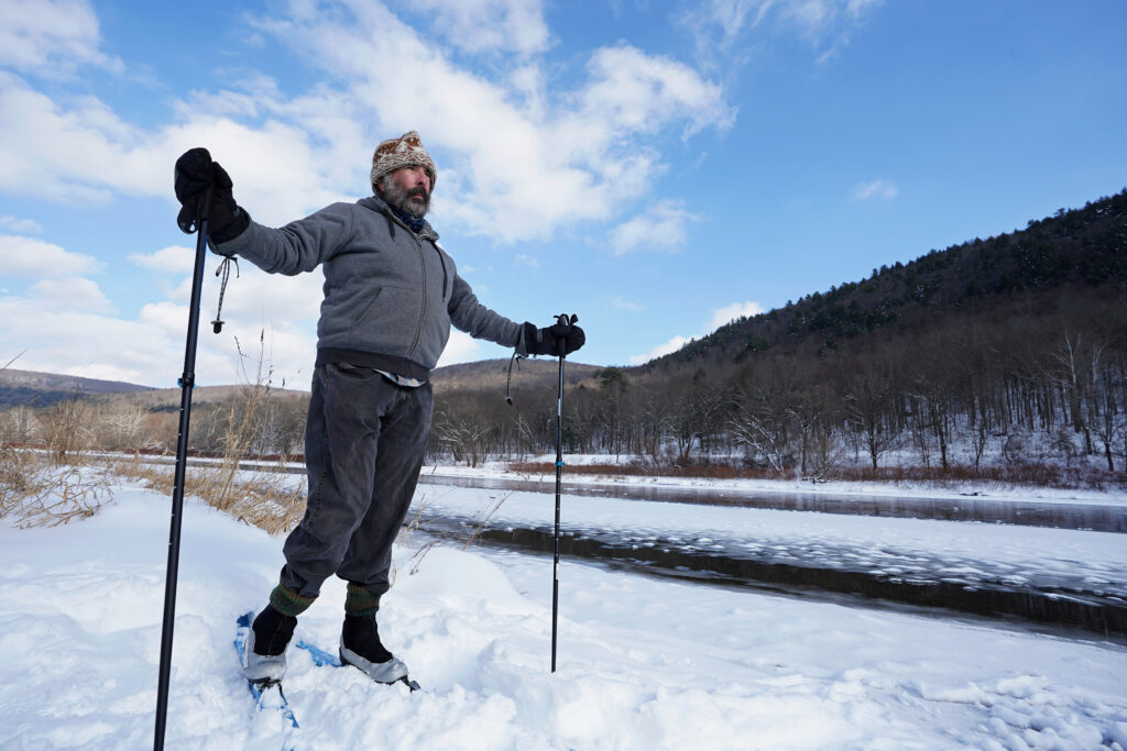 Delaware River Project 02 Steve Schwartz uses skis to get around in the snow on his property right along the Delaware River in Equinunk, Pennsylvania. (Matt Smith/WHYY)