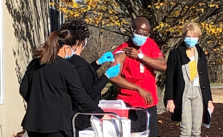 Nurse Kolubah Goniah is vaccinated against COVID-19