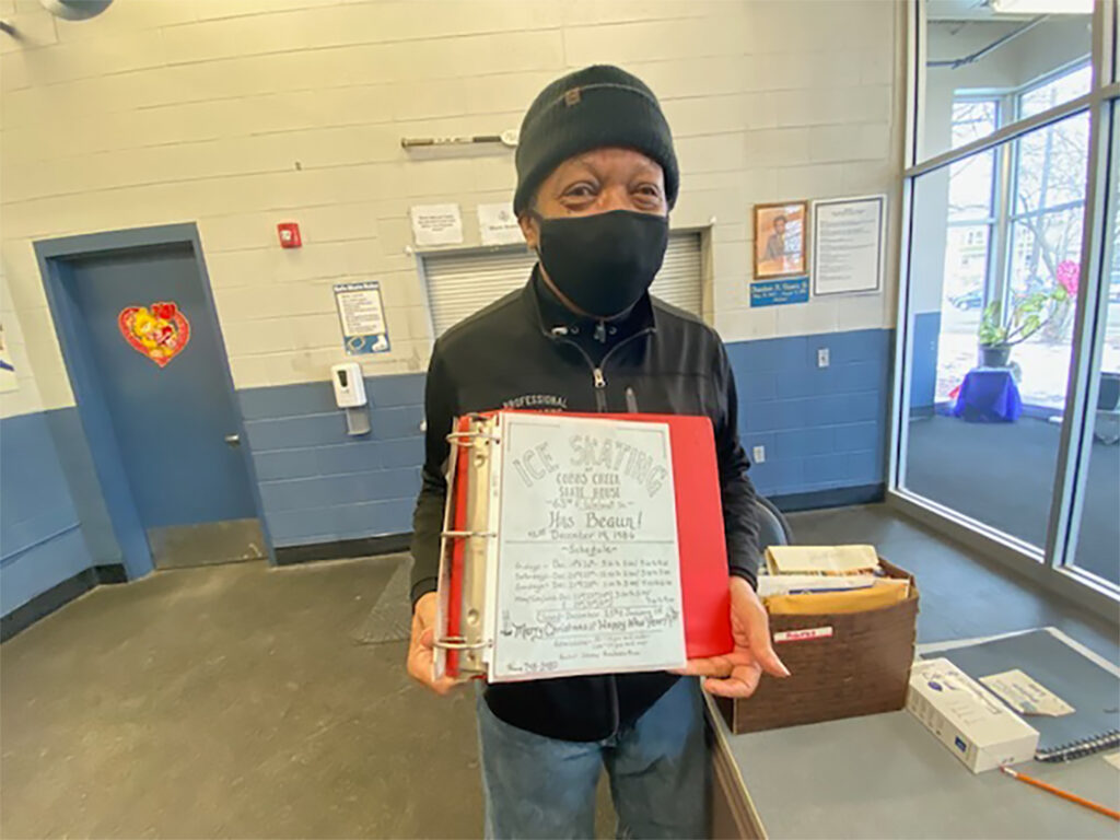 IMG_1051 Jimi Lewis, the senior skating instructor at Laura Sims Skate House, holds a flyer from 1986 that he created. (Taylor Allen/WHYY)