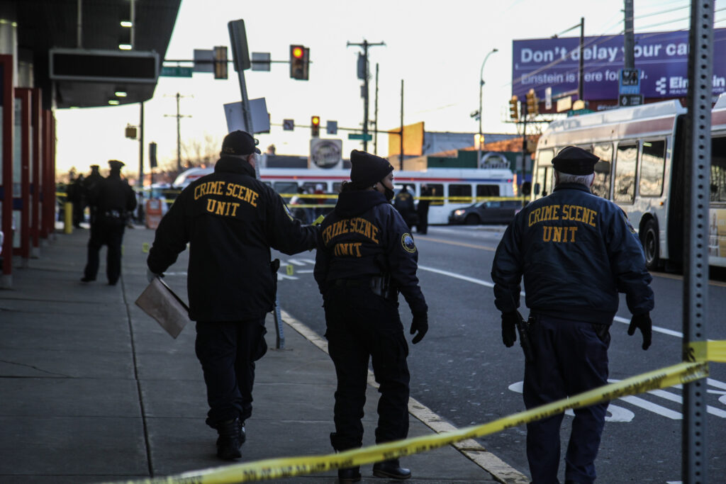 IMG_5238 Members of the Philadelphia Police Department’s Crime Scene Unit are pictured behind crime scene tape