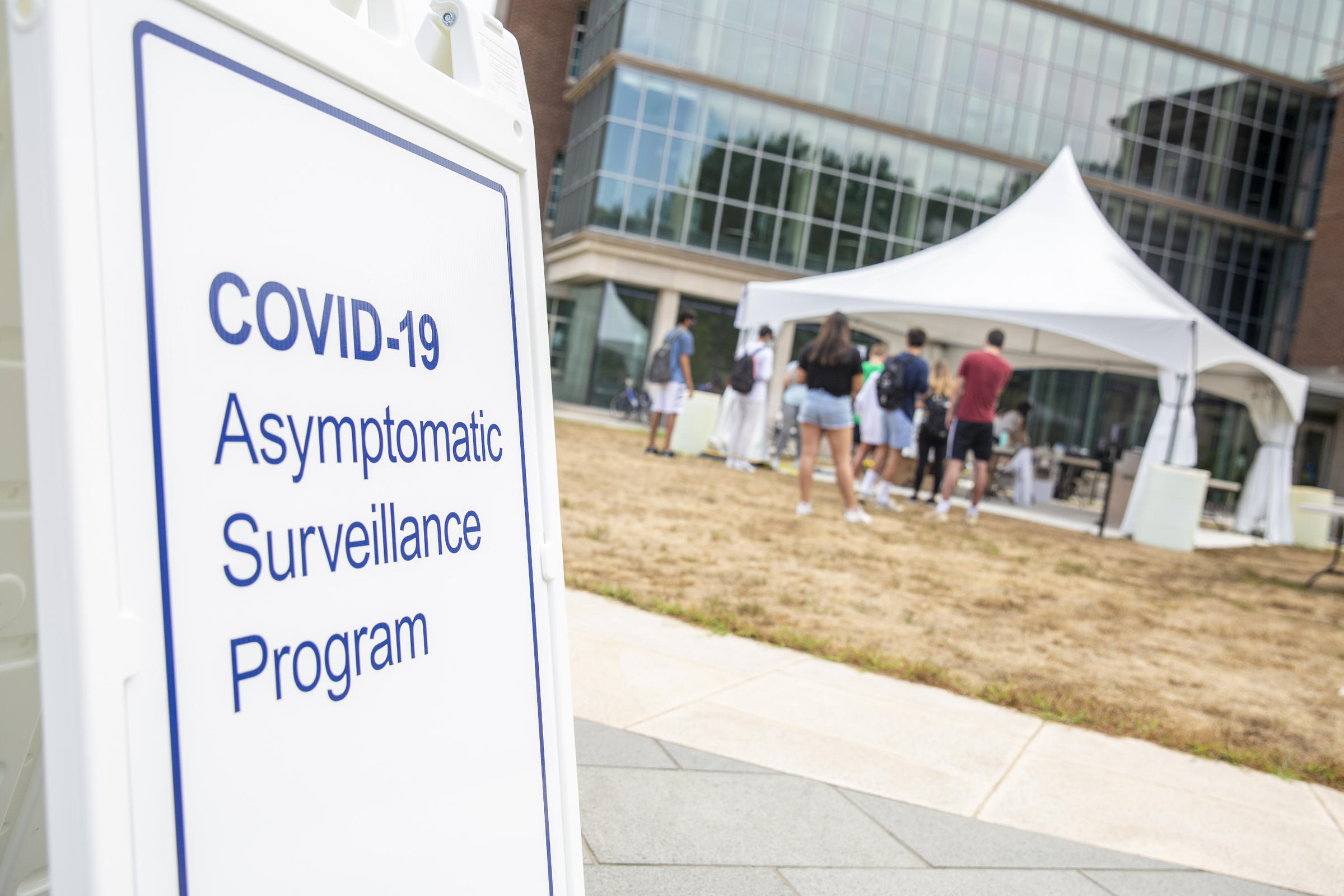 Students line up at a COVID-19 test site at Penn State's campus