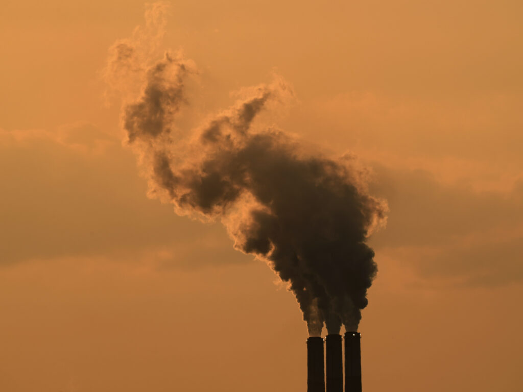 Smokestacks at the Jeffrey Energy Center coal-fired power plant are silhouetted against the sky at sunset in September near Emmet, Kan. Smokestacks at the Jeffrey Energy Center coal-fired power plant are silhouetted against the sky at sunset in September near Emmet, Kan. (Charlie Riedel/AP)