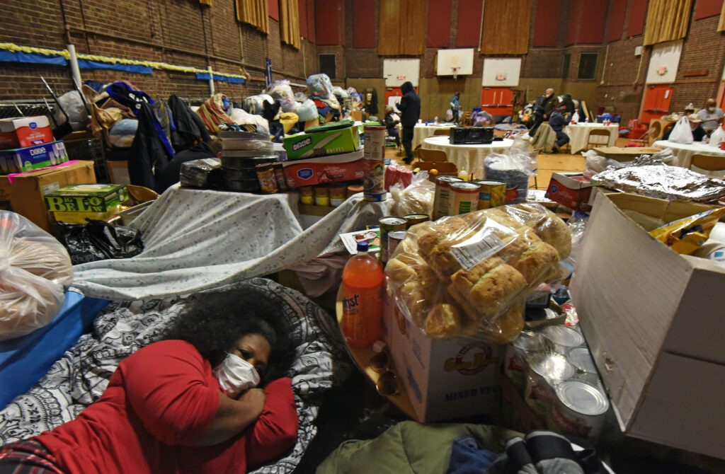 camden_shelter_AS_021521_02 Tawanda Jones rests in what she calls her