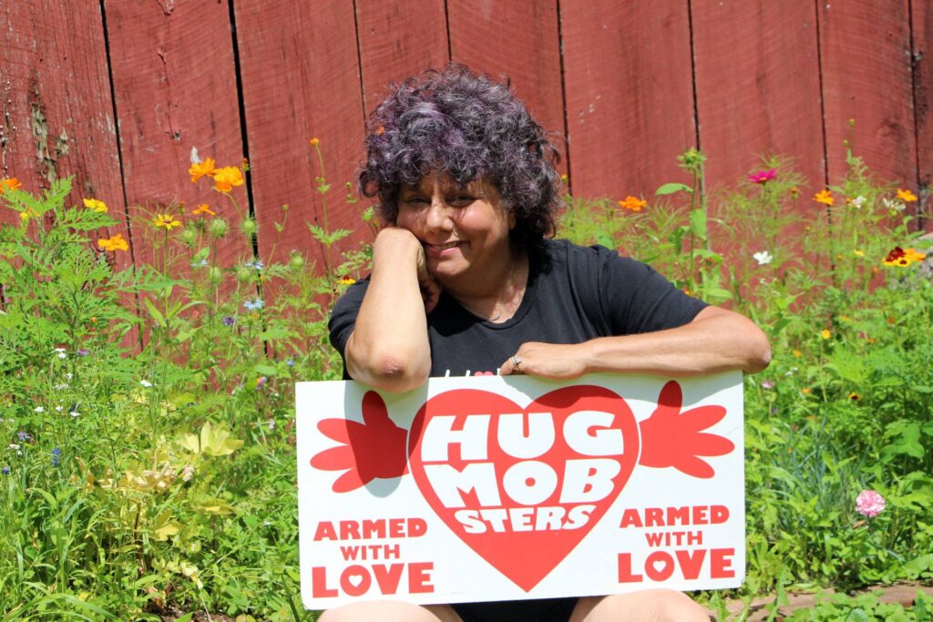 flowerhugs Edie Weinstein, founder of Hug Mobsters Armed With Love, is giving out 'virtual hugs' this Valentine's Day. (Photo by Kim Krause Berg)