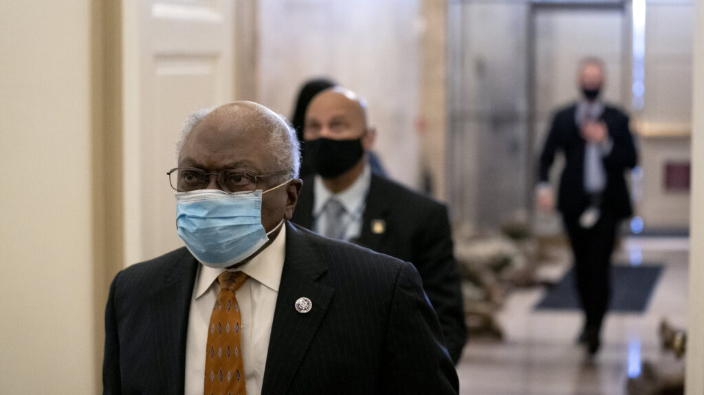 James Clyburn (D-SC) (L) wears a protective mask while arriving to the U.S. Capitol