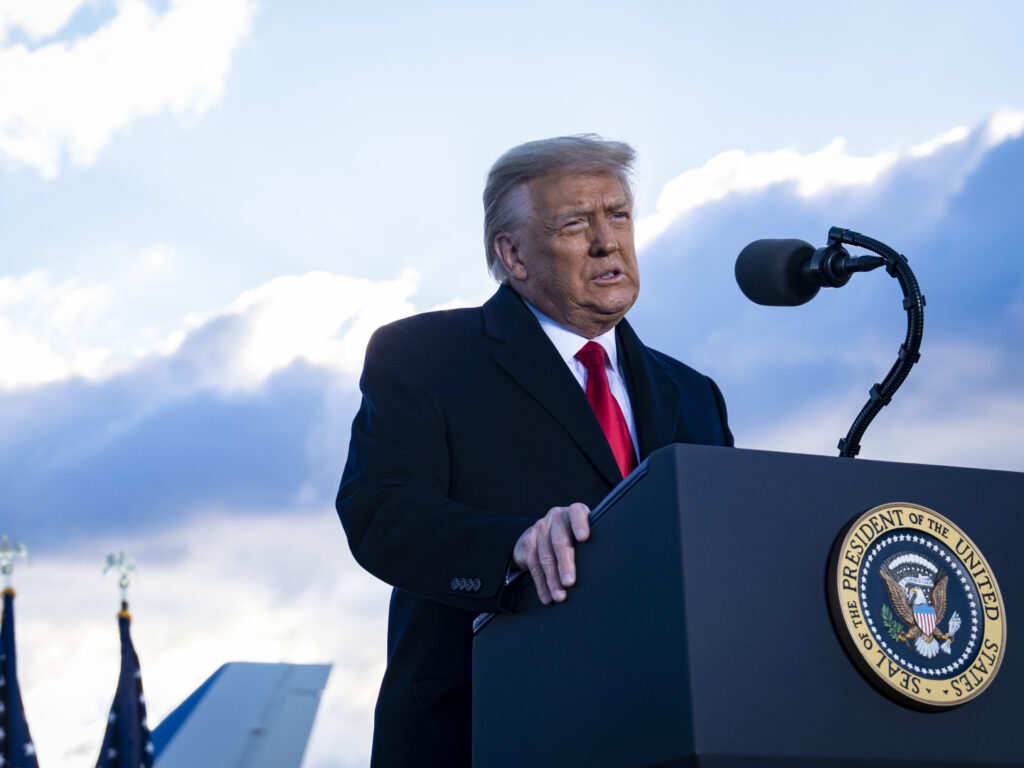 President Donald Trump speaks to supporters at Joint Base Andrews before boarding Air Force One for his last time as President on January 20, 2021 in Joint Base Andrews, Maryland