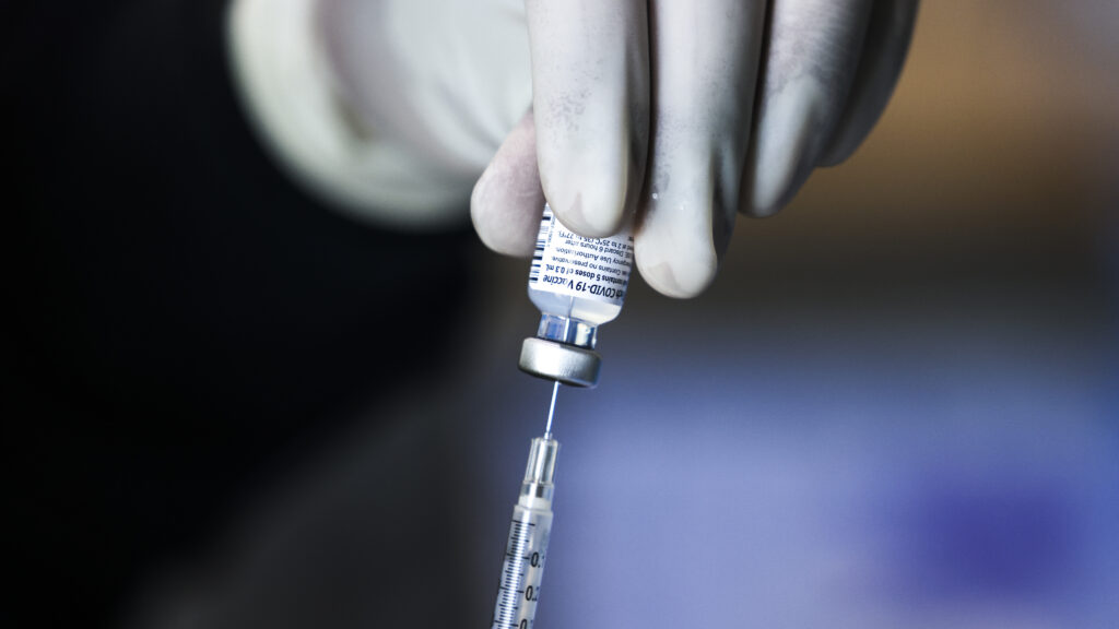A pharmacy technician prepares doses of the Pfizer-BioNTech vaccine at a mass vaccination event on Saturday in Denver. A pharmacy technician prepares doses of the Pfizer-BioNTech vaccine at a mass vaccination event on Saturday in Denver.