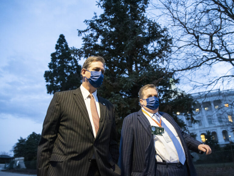 Bruce Castor (left), defense attorney for former President Donald Trump, departs the Capitol following the first day of the impeachment trial. Sarah Silbiger/Getty Images