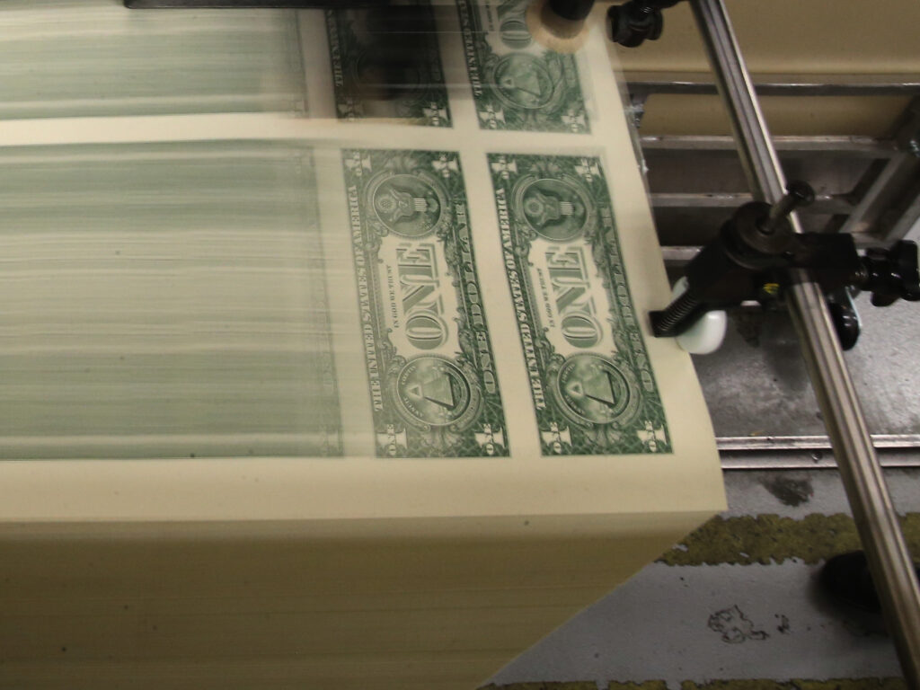 Sheets of one-dollar bills run through the printing press at the Bureau of Engraving and Printing in 2015 in Washington, D.C. Congressional forecasters projected the federal deficit this fiscal year will hit its highest since World War II. Sheets of one-dollar bills run through the printing press at the Bureau of Engraving and Printing in 2015 in Washington, D.C. Congressional forecasters projected the federal deficit this fiscal year will hit its highest since World War II. (Mark Wilson/Getty Images)
