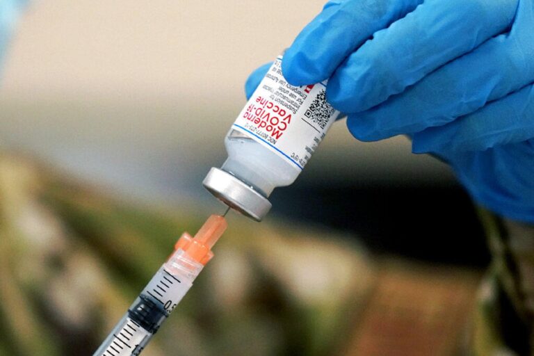 Mississippi Air Guard Tech. Sgt. Exstrella Smith withdraws a dose of the Moderna COVID-19 vaccine for injection on Wednesday, Dec. 23, 2020, in Flowood, Miss. (Rogelio V. Solis/AP Photo)