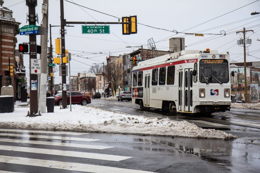 philly_snow_020221_KP_17 SEPTA’s 13 trolley rolls down Lancaster Avenue in Philadelphia’s Belmont neighborhood.
