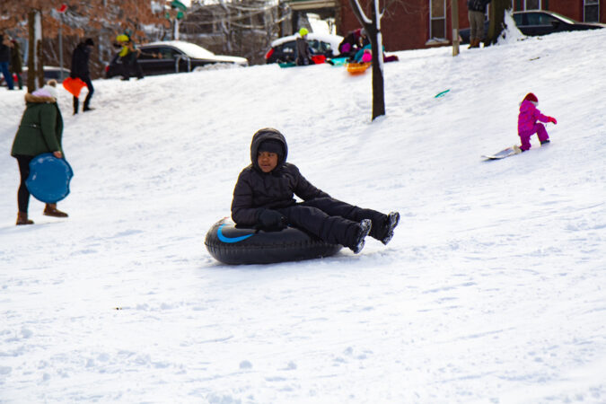 A person sleds at Clark Park in West Philly