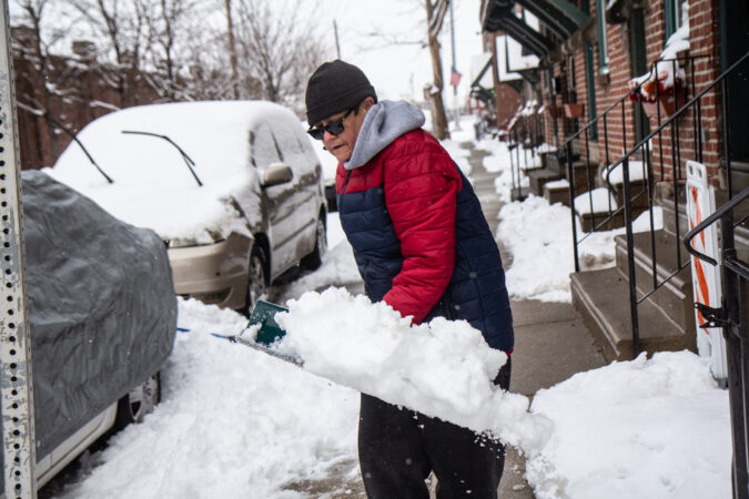A man shovels snow in Philadelphia