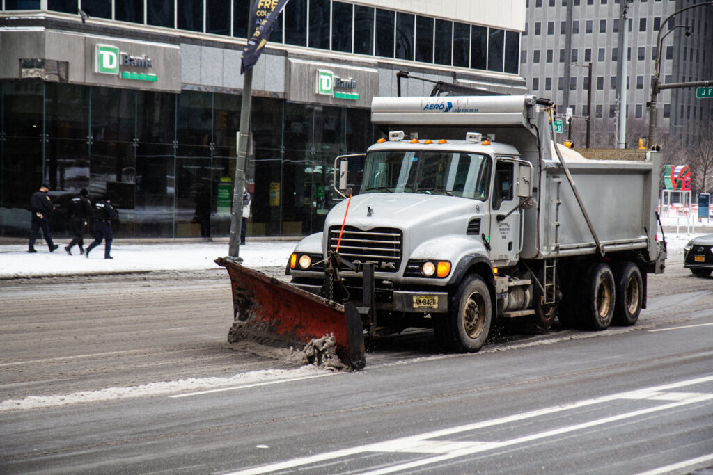 Snow plows circle City Hall