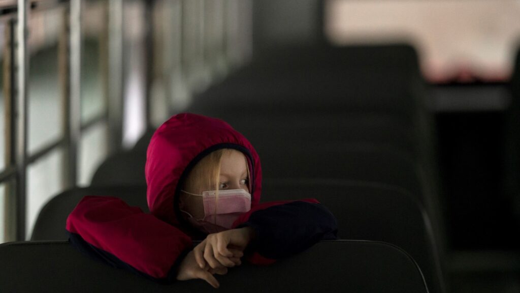 A first-grade student sits on the bus after a day of classes in Woodland, Wash., on Thursday. A first-grade student sits on the bus after a day of classes in Woodland, Wash., on Thursday.
