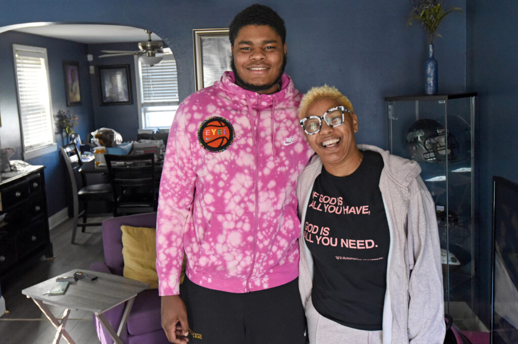 01 (3) Ta'Quan Woodley poses for a photo with Tracey Hall, who invited him to live in her Camden home in February of 2020. She said he has been