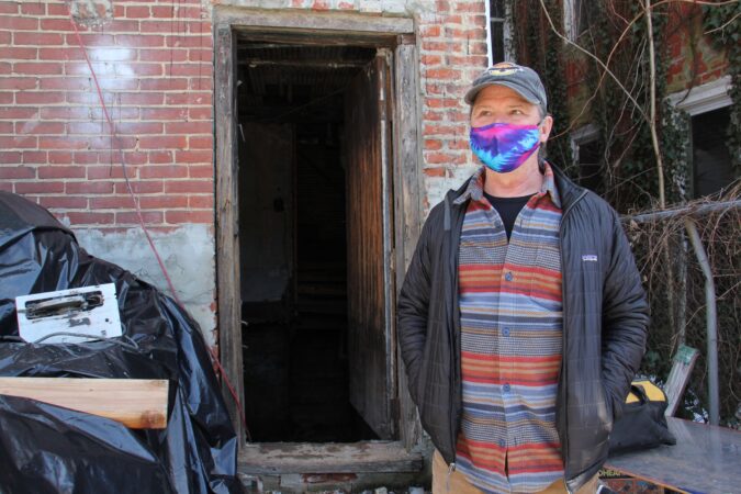 Frank Reiss stands outside the Sun Ra House
