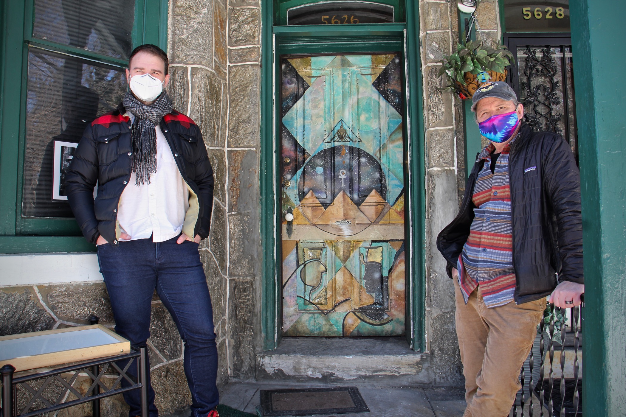 Mark Christman (left) and Frank Reiss stand outside the Sun Ra House