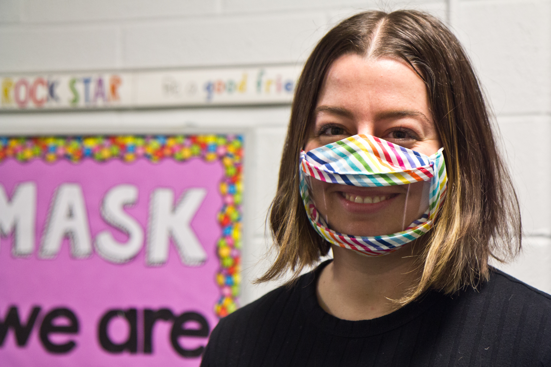 Kindergarten teacher Katie Trott wears a clear face mask inside the classroom