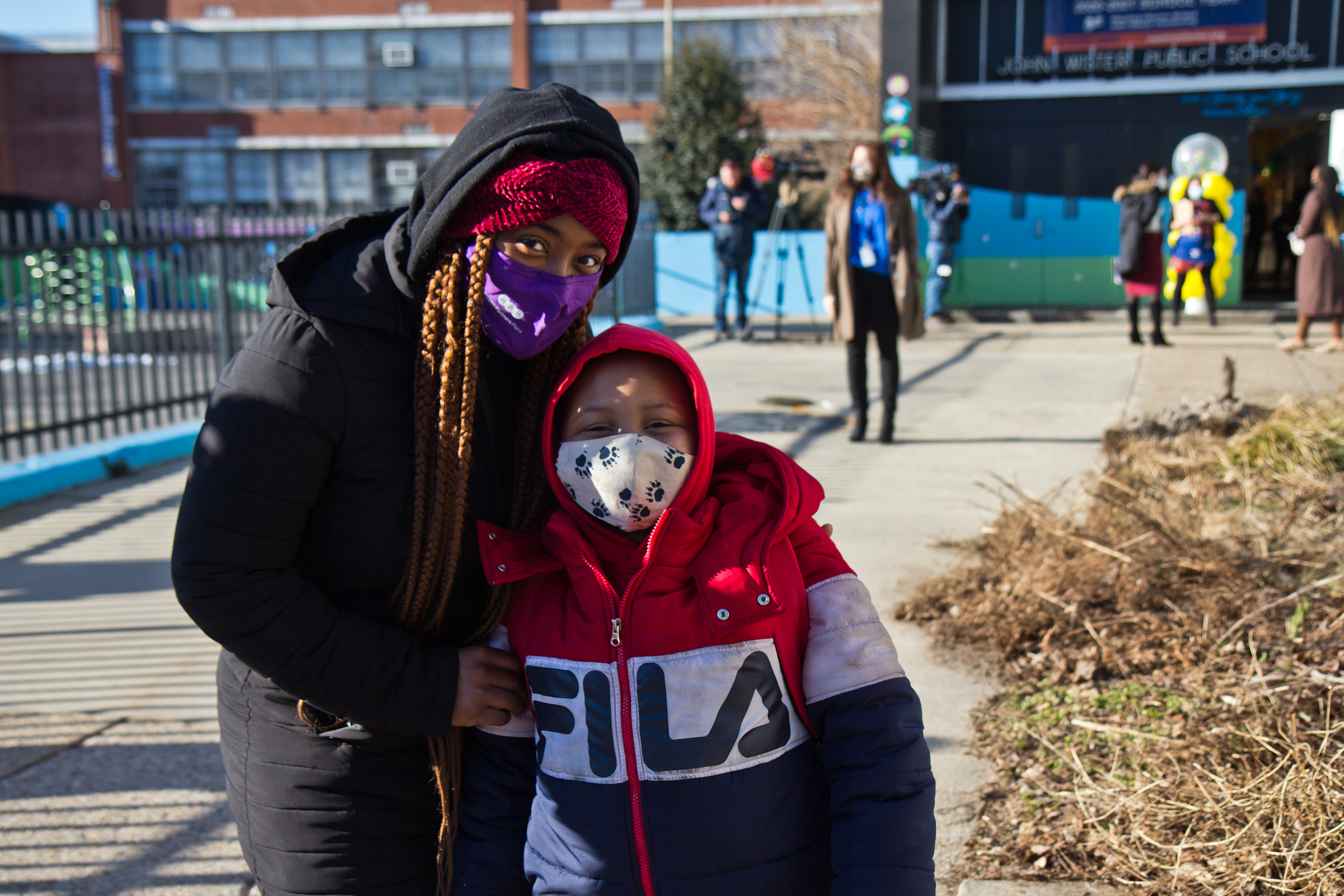Deneen Kennedy stands with her son, Amari, outside