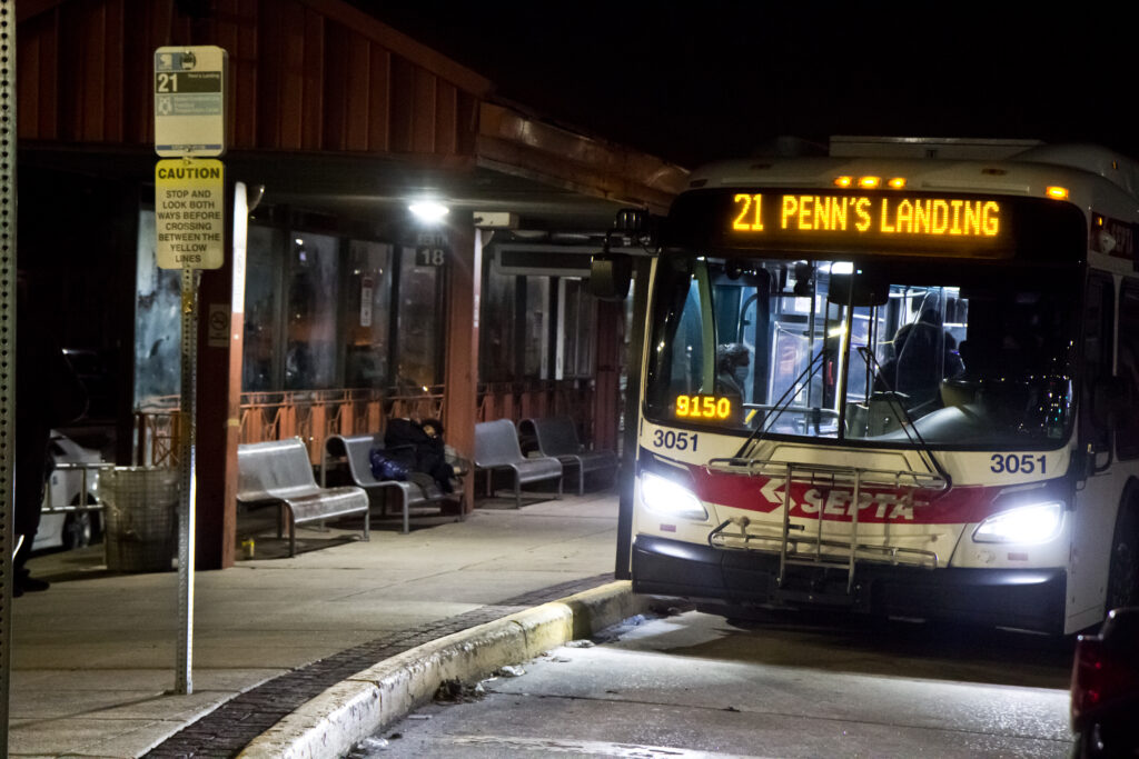 2021 03 04 k paynter 69th street late night transit police Transit riders board a SEPTA bus at the 69th Street bus depot in Upper Darby. (Kimberly Paynter/WHYY)