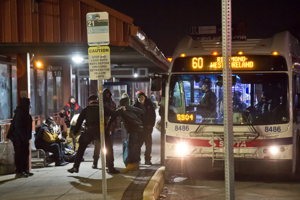 2021 03 04 k paynter 69th street late night transit police-9 Transit police forcibly remover a violent passenger from a SEPTA bus in Upper Darby, Pa., around 1 a.m. on March 4, 2021. (Kimberly Paynter/WHYY)