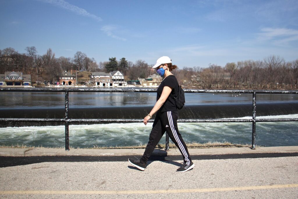2021 03 11-e lee-maria becker gallagher-philadelphia martin luth Maria Becker Gallagher strolls past the Schuylkill River on Martin Luther King Drive on March 11, 2021. (Emma Lee/WHYY)
